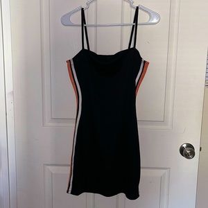 Black mini dress with orange and white stripe down the side
